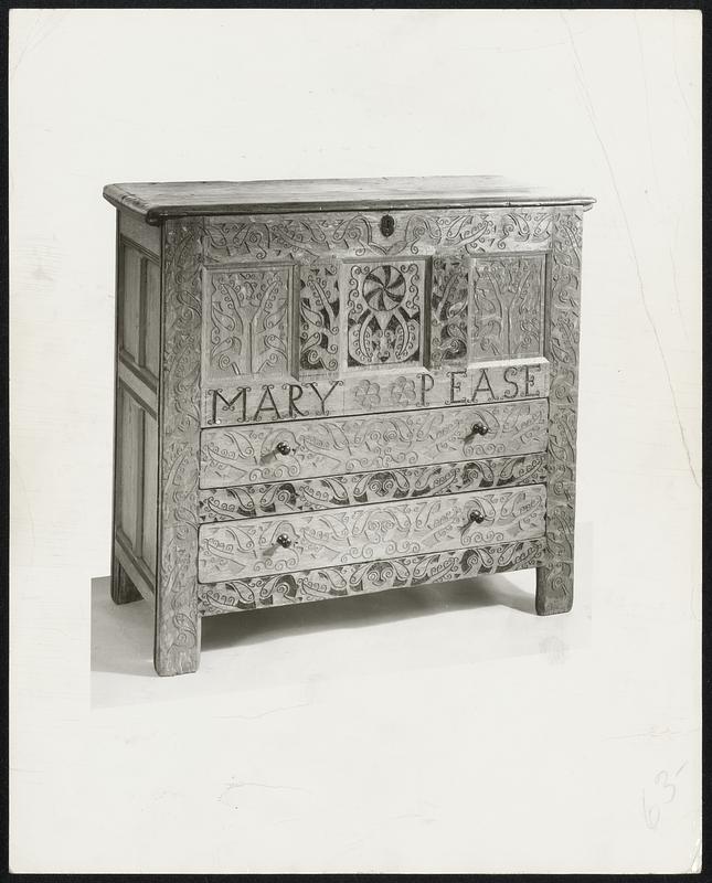 Wondrously Cut in Wood-- A 17th century American “Hadley chest” made from oak. The handsome trellis scrollwork covers the entire front of this chest and the motifs of the carving show a high degree of sophistication.