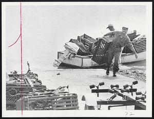 Scituate Lobsterman Tom Patterson, who also is a police officer, hauled his lobster pots late yesterday from the reach of a destructive sea which Esther is expected to churn today.