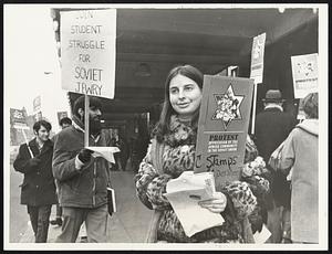Literature was handed out by Harriet Sherman while pickets marched in front of Symphony Hall waiting for orchestra members to show up.