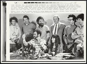 Chicago Seven Defendants at a Happier Time--Five of the seven defendants charged with conspiracy to riot at time of 1968 Democratic Convention are pictured earlier in their lengthy trial which ended with five convicted of inciting to riot and all seven acquitted of conspiracy. Two acquitted were John Froines, second from left, and Lee Weiner, third from left, rear row. Left to right: Abbie Hoffman; Froines; Weiner; David Dellinger, Rennie Davis, and Tom Hayden. Seated is Jerry Rubin with his girl friend, Nancy Kurshan. She was not involved in the trial.