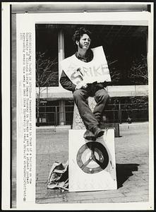 He's On Strike -- A demonstrator sits in front of a building on the University of Illinois Circle Campus Thursday in Chicago as part of a student protest surrounding events this week at Kent State University in Kent, Ohio.