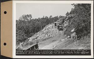 Contract No. 82, Constructing Quabbin Hill Road, Ware, ledge excavation, looking ahead from Sta. 23+75, Ware, Mass., Jun. 15, 1939