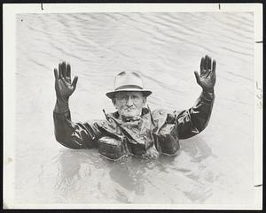 New Style Note for the Torpedoed Sailor Horatio C. Ball, Washington building contractor, demonstrates a one-piece life-saving suit which he designed himself.