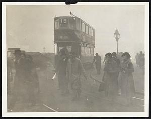 Fog Over London. London had its first severe fog of the year on Oct. 10 and traffic by land, sea and air was pretty much disorganized. London city orkers are shown making their way through the darkened streets in the morning of Oct. 18.