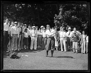 Spectators watching Gene Sarazen play golf