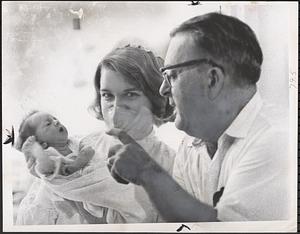 Mary Elizabeth, 4, held by student nurse Ruth Holbrook