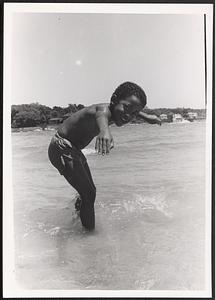 Damien posing in the surf at the beach