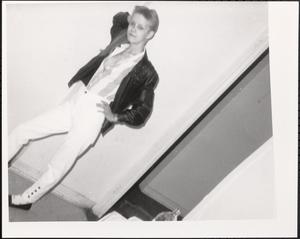 Teenager posing with hand on hip
