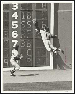 Just Missed - Yankee centerfielder Bobby Murcer goes against wall but can't get Luis Alvarado's double in third inning. Backing him up is leftfielder Frank Tepedino.