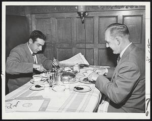 Competitors and Pals are these Washington Senators second baseman, Gene Verble (left) and Cass Michaels, dining together at the Hotel Kenmore today before leaving for Fenway Park and their game with the Red Sox. Verble, a rookie sensation, has the inside track on the second bas job at present, but Cass is still in there battling for the berth.