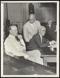 The mayoralty forces at the finance commission hearing. Left to right, the mayor, ast. corporation counsel Joseph T. Brennan and Joseph F. Mellyn, the mayor's secretary.