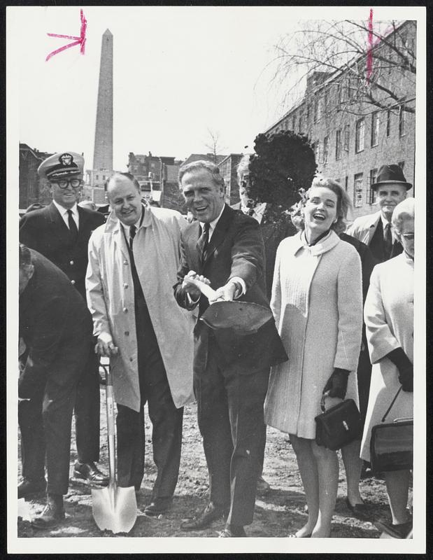 Shovelful of Dirt is heaved playfully by Mayor White at cameraman at groundbreaking for $5.7 million Little Mystic co-operative housing development in Charlestown. With him are BRA Director Hale Champion and his wife, Kathryn White, a Charlestown girl.