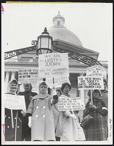 Mrs. Thomas F. Doody (light coat, white buttons) of Somerville leads 50 women who converged on State House to fight abolition of the death penalty. Mrs. Doody is the wife of a Somerville policeman.