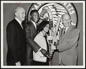 Red Sox Slugger George Scott, with his bride-to-be Melvina Pena, was appointed to the sales promotion staff of the Mass. Envelope Company yesterday. Company officials are Jerome Grossman (left) and Edgar Grossman (right). Scott will be married Sunday.
