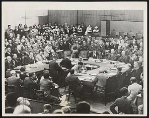 Tense Expressions prevailed when this photograph was taken during League of Nations' session. It shows the chamber scene immediately after the Italian delegates-Baron Aloisi and Signor Rocco-walked out. Note the empty chair of Baron Aloisi on Premier Laval's right. Anthony Eden of England and Russian delegate, Litvinof, can be seen both with hands resting on their chins.