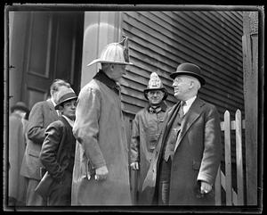 Firefighter in a conversation with an unidentified man