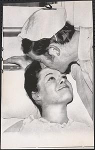 Husbandly kiss for multiple birth mother