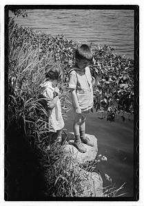 Children by a body of water