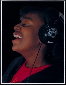 Girl with headphones singing