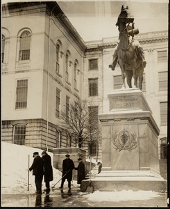 Removing snow from around the Hooker monument & path at the State House