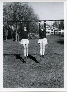 Karen Fleck and Ann Harris, Class of '63 on athletic field