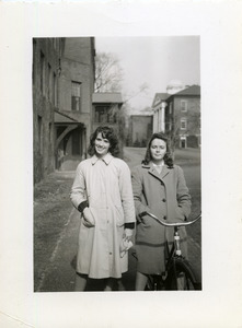 Abbot Academy students walking on campus with bicycle