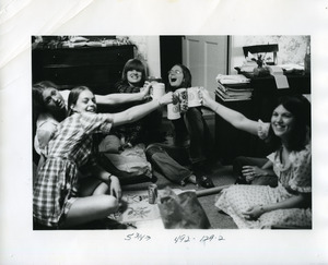 Students toasting in student room including Cathy Von Klemperer '73, Connee Petty '73, Sarah Bayldon '73, Robin Lothrop '73, Sue Costa '73
