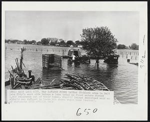 Flood Forms Lake-A 50-block area in Salt Lake City's west side became a lake today as flood waters forced 1,600 residents out of their homes. Sheriff George Beckstead said an elderly man refused to leave his sheep wagon home (center).