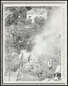 A house, still smoldering, lies in ruins 8/18, the victim of one of many fires triggered by Hurricane Camille.