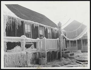 Summer is a long way off for this ice-encrusted vacation place on Lighthouse Rd. in Sand Hills section of Scituate. Coating is due to salt sea spray.