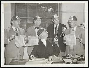 Baseball philatelists await the Farley signature. Let to right, in the rear: Warren Giles, vice-president of the Cincinnati Reds; Bill McKechnie, manager of the Reds; Bill Terry, manager of the Giants, and Clark Griffith, president of the Senators, with samples of the new issue of the baseball stamps commemorating the 100th anniversary of the game. In front is Postmaster General Jim Farley, ready to autograph the stamps.