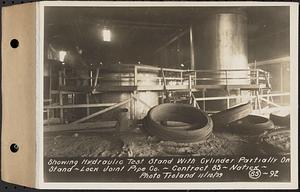 Contract No. 85, Manufacture and Delivery of Precast Concrete Steel Cylinder Pipe, Southborough, Framingham, Wayland, Natick, Weston, showing hydraulic test stand with cylinder partially on stand, Natick, Mass., Nov. 10, 1939