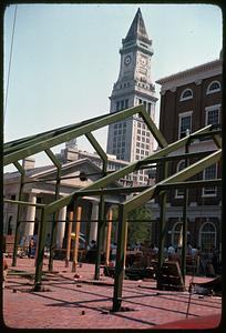 Metallic structure with Quincy Market, Faneuil Hall and Custom House Tower in background, Boston