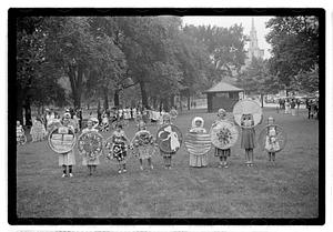 Group holding circular emblems