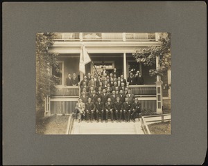 Portrait of men sitting on a porch