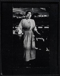 Mrs. DiStefano standing in spinning room c. 1918