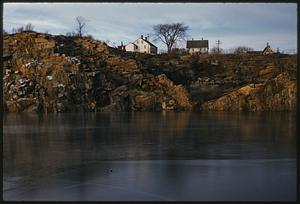 View from water of houses on cliff, Rockport, Massachusetts