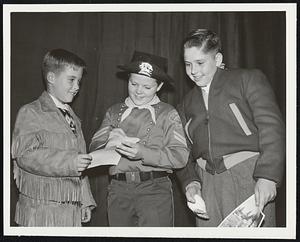 From the Yankee Network. For Immediate Release. Melrose Youngsters visit W.N.A.C. stars of the adventures of Rin Tin Tin, Lee Aaker at Bosten Garden last night where he appeared in the rodeo. They are (1-r) Richard Phillips, Lee Aaker, and Johnny Bickford..