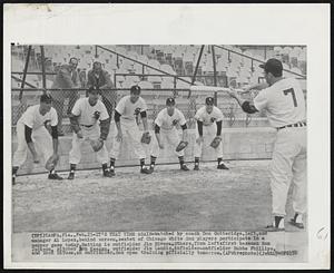 It's That Time Again-Watched by coach Don Gutteridge, left, and manager Al Lopez, behind screen, sextet of Chicago White Sox players participate in a pepper game today. Batting is outfielder Jim Rivera. Others, from left: first baseman Ron Jackson, pitcher Bob Keegan, outfielder Jim Landis, infielder-outfielder Bubba Phillips, and Dick DiTusa, an outfielder. Sox open training officially tomorrow.