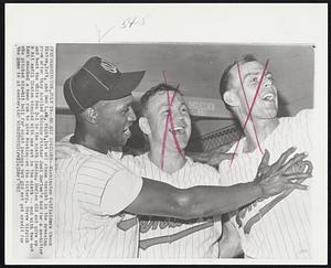 Washington – No Hit Spoilers – Washington Outfielders Chuck Hinton, left, and Don Lock, right, let off steam tonight in the dressing room after they spoiled Chicago Pitcher Joel Horlen’s bid for a no-hitter and beat the White Sox 2-1 in the ninth inning. Horlen did not give up a hit until Hinton singled with one out in the ninth – and with two out Lock smacked a home run to give Washington the victory. Steve Ridzik who pitched six-hit ball for the game is at center.