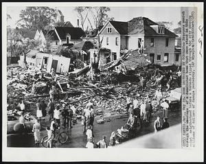 Home Destroyed by Tornado-- Rescuers search through the wreckage of a demolished home that once stood in this quiet neighborhood before a tornado ripped through the city causing millions of dollars of damage yesterday.