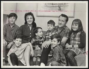 Robert Thompson and family at their Lynn home. From left, are James, 12, Stephen, 7, Mrs. Marie Thompson, Scotty, 3, Michael, 2, Robert Jr., 8, Robert Thompson, and Laura, 10.
