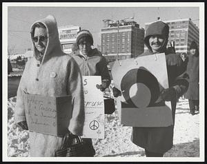 Anti Vietnam-draft demonstrators bundled up for the cold