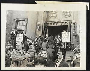 Pacifists flee into Arlington Street Church as they are pelted with eggs and beer cans hurled by spectators on the sidewalk 3/26. Some 1,000 marchers hiked from Cambridge to the Arlington Street Church in Boston to protest American policy in Vietnam.