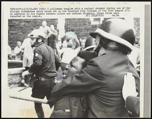 New York: A Policeman tangles with a radical student during one of the violent skirmishes which broke out on the troubled City College of New York campus 5/8. In addition to the fights between police and radical students, three fires were reported on the campus.