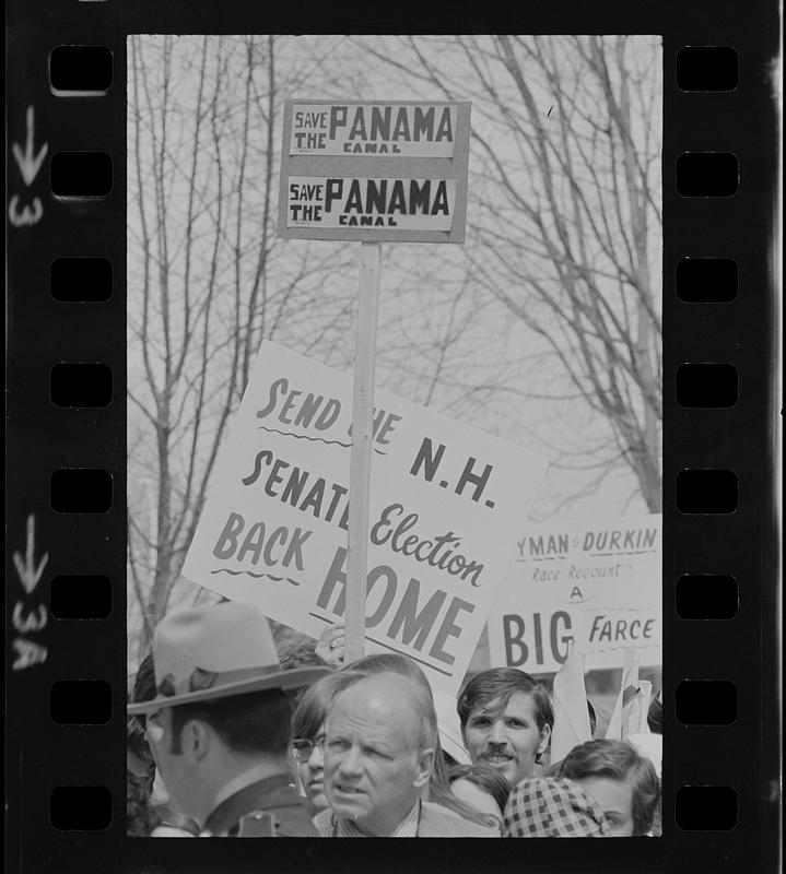 Crowd holding signs during President Gerald Ford's visit in Concord, New Hampshire