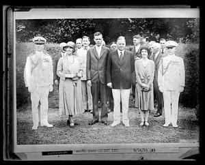 A group of people that include Lou and Herbert Hoover as well as Charles and Anne Lindbergh