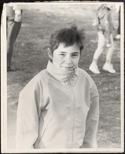 Smiling child in fully-zipped coat