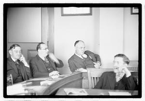 Group of men at table