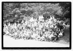 Boys holding model sailboats
